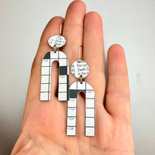 Load image into Gallery viewer, Crossword Horseshoe Tin Earrings