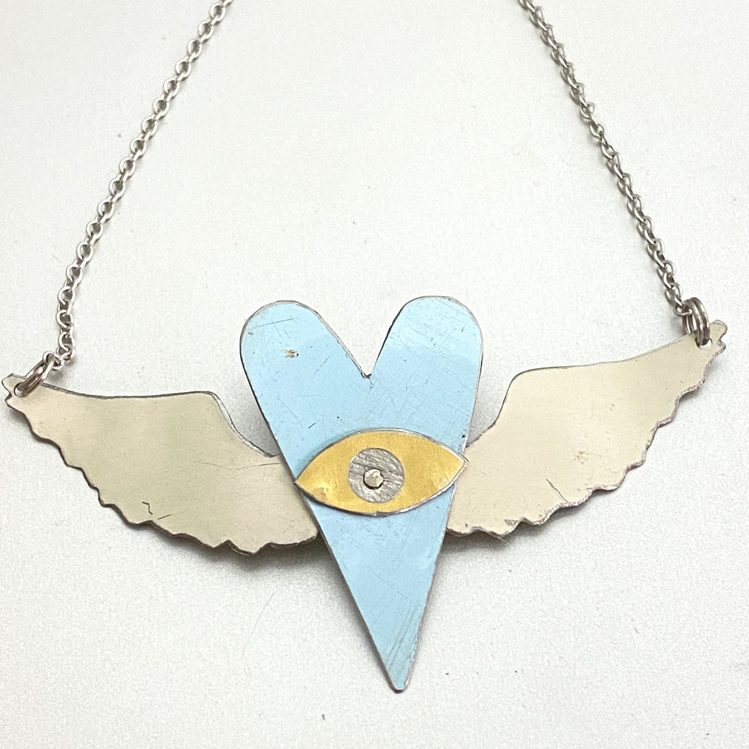 The Heart Sees Icy Blue Tin Necklace