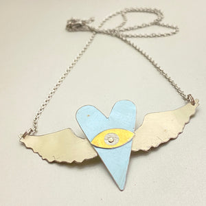 The Heart Sees Icy Blue Tin Necklace