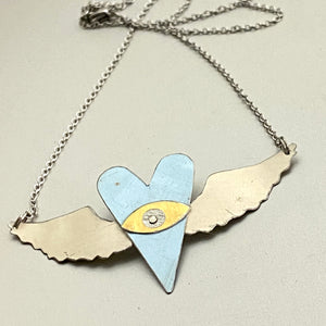 The Heart Sees Icy Blue Tin Necklace