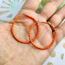 Load image into Gallery viewer, Spiraled Tin Bright Orange Hoop Earrings